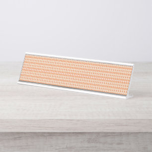 Een oranje tapijt met een gestructureerd patroon l bureau naambordje