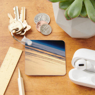 Een orbitale zonsondergang voor de kust van Baja C Sleutelhanger