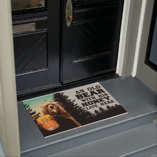 Een oud Beer met zijn honing leeft hier in een deu Deurmat