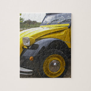Een oude zwarte en gele Citroen 2CV 2 CV, Legpuzzel
