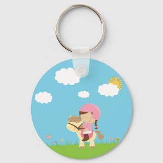 Een paardenbruin meisje met een paardenhaar sleute sleutelhanger