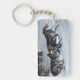 Een pakket wolven die door de sneeuw lopen sleutelhanger