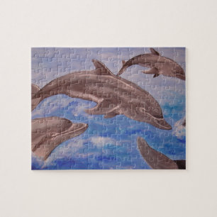 Een peul speelse dolfijnen legpuzzel