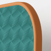 Een pickleball-paddle met een gestructureerd teal  pickleball paddle (Links Detail)