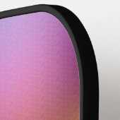 Een pickleball-paddle met een verloop roze pickleball paddle (Links Detail)