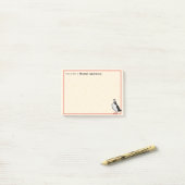Eén Puffin op de bureau van 4x3 PostIt Note Pad (Op bureau)