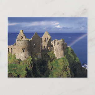 Een regenboogaanval op de middeleeuwse Dunluce Cas Briefkaart