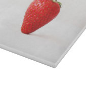 Eén rode aardbei cbcna snijplank (Hoek)