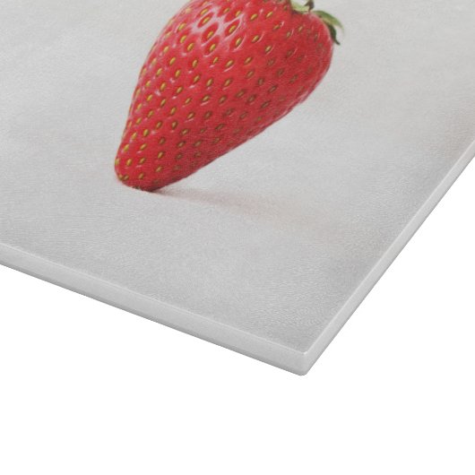 Eén rode aardbei cbcna snijplank (Hoek)