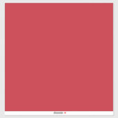 Een rode achtergrond met een sticker (Vel)