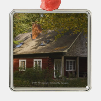 Een rode logstartpagina metalen ornament