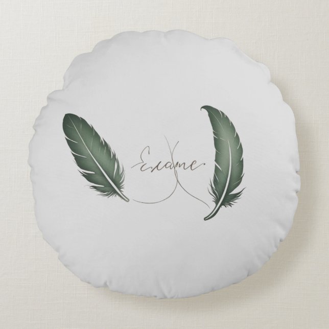 Een rond kussen met minimalistisch design erop. (Voorkant)