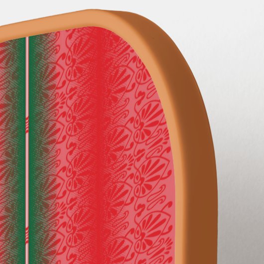 Een rood en groen gestreepte achtergrond pickleball paddle (Links Detail)