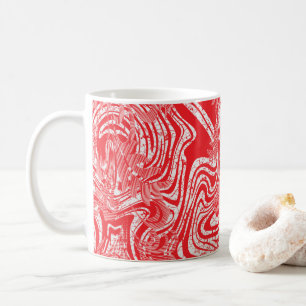 Een rood-wit afbeelding van een patroon op een wit koffiemok