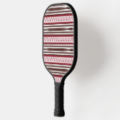 Een rood-wit gestreept patroon pickleball paddle (Links)