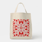 Een rood-wit patroon met een bloem erop tote bag (Achterkant)