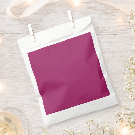 Een roze achtergrond met een witte achtergrond bedankzakje (Geknipt)