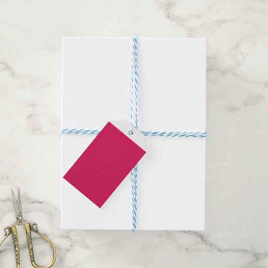 Een roze achtergrond met een witte rand cadeaulabel (Met Touw)