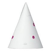 Een roze bloem met zwarte vlekken op zijn bloembla feesthoedjes (Links)