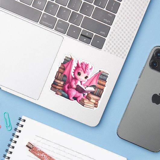 Een roze Dragon Reading Sticker (Laptop met iPhone)