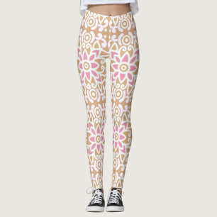 Een roze en witte bloem patroon op een bruine acht leggings