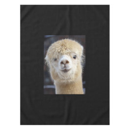 Een schattig pluizig gezicht van een alpaca tafelkleed