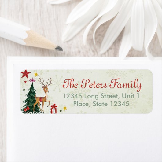 Een schattige groene kerstboomrendiertje met een m etiket (Insitu)