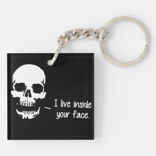 Een schedel leeft in je gezicht sleutelhanger (Achterkant)