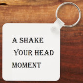 Een schud je hoofd momenten sleutelhanger (Achterkant)