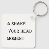 Een schud je hoofd momenten sleutelhanger (Achterkant)