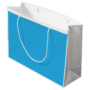 Een serene blauwe lucht met een paar verspreide wi groot cadeauzakje