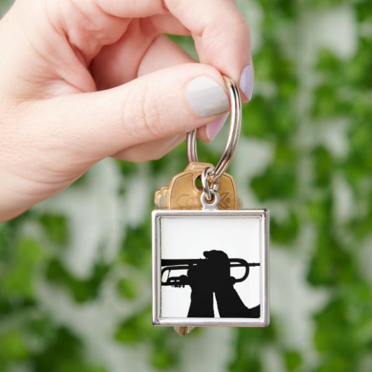 Een servicelid speelt een melodie sleutelhanger (Hand)