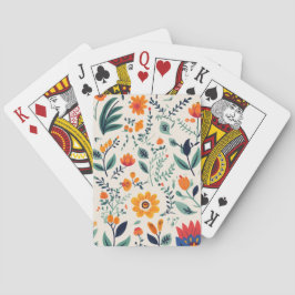 Een set speelkaarten met een bloemenachtergrondont