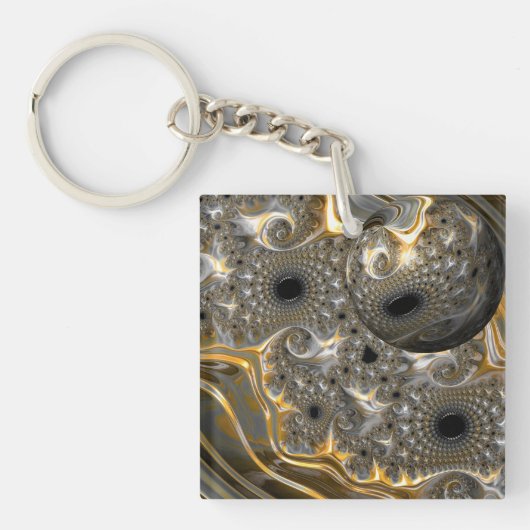 Een sferisch ballet in zilver en goud sleutelhanger (voorkant)