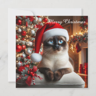 Een siamees kat draagt een kerstmannenhoed feestdagenkaart