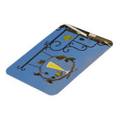 Een smeedijzeren bord dat het thema illustreert magneet (Linkerzijde)