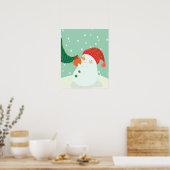 Een sneeuwman die een ornament aan een boom hangt poster (Keuken)