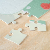 Een sneeuwman die een versiering aan een boom hang legpuzzel (Zijkant)