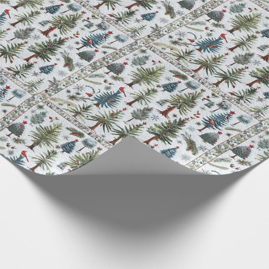 Een sneeuwman en kerstbomen in een gewatteerd patr cadeaupapier (Hoek)