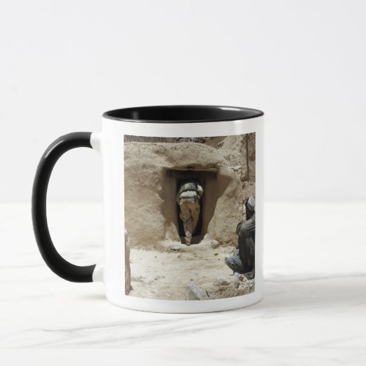 Een soldaat van de Nationale Garde Mok (Links)