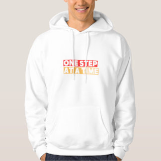 Eén Stap per Tijd – Inspirerende Voortgangsquote Hoodie