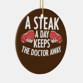 Een stapel per dag houdt de dokter weg met het ete keramisch ornament (Rechts)
