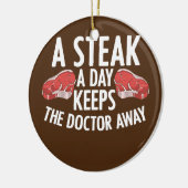 Een stapel per dag houdt de dokter weg met het ete keramisch ornament (Links)