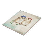 Een stel met kleurrijke sjaals op een boomtak. tegeltje (Zijkant)