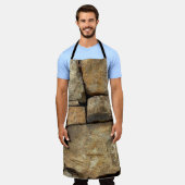 Een stenen muur gemaakt van cobblestenen achtergro schort (Gedragen)