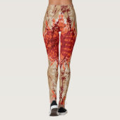 Een stof met een oranje en bruin patroon, leggings (Achterkant)