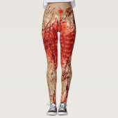 Een stof met een oranje en bruin patroon, leggings (Voorkant)