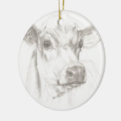 Een tekening van een jonge koe keramisch ornament (Links)