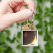 Een troebele Jupiter-achtige planeet die ronddraai Sleutelhanger (Hand)