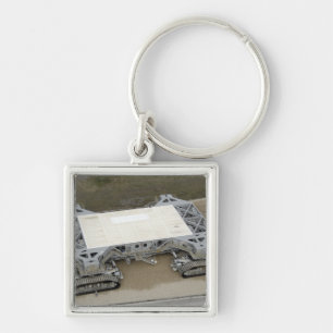 Een uitzicht van de kruipwagen sleutelhanger